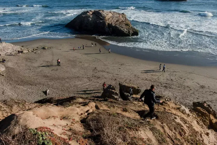 Nick Whittlesey walking down to Ocean Beach